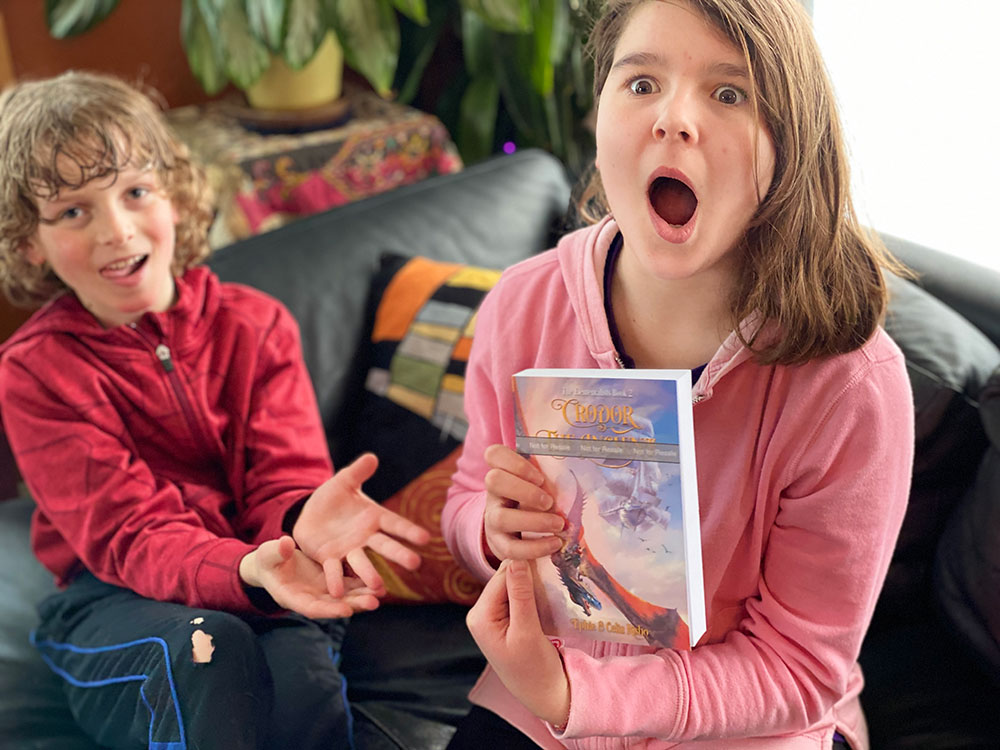 Blue wide-eyed and astonished, holding an early copy of Crodor the Ancient